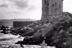 A fortified tower by the sea in the district of Lower Marciana in the Elba island. Lower Marciana, August 1956 (Photo by Mario De Biasi\Mondadori Portfolio by Getty Images)
